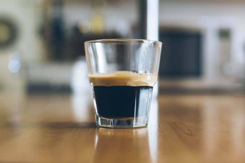 Fresh espresso being pulled from a commercial machine